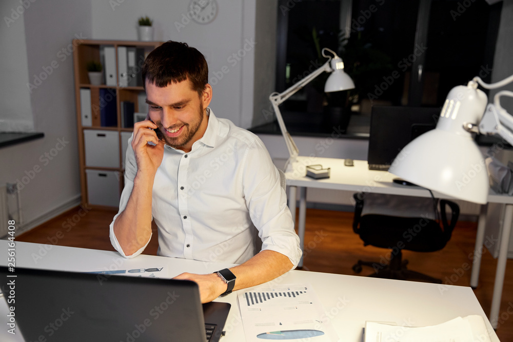 Sticker business, overwork, deadline and people concept - happy businessman with computer calling on smartph