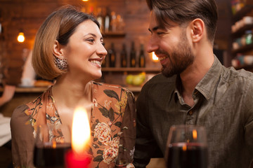 Young couple looking in each others eyes and laughing