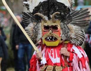 Zemen, Bulgaria - March 16, 2019: Masquerade festival Surva in Zemen, Bulgaria. People with mask called Kukeri dance and perform to scare the evil spirits.