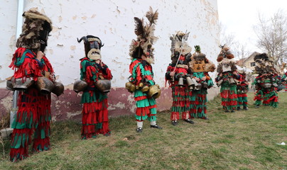 Zemen, Bulgaria - March 16, 2019: Masquerade festival Surva in Zemen, Bulgaria. People with mask called Kukeri dance and perform to scare the evil spirits.