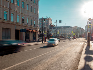 Obraz premium Fast moving vehicles on the road of the city at sunset time. Moscow streets with a moving vehicles