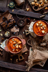 Two clay bowls with vegetable cream soup