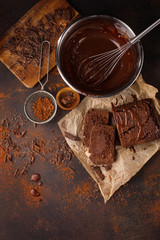 Homemade chocolate cake and cream with whisk