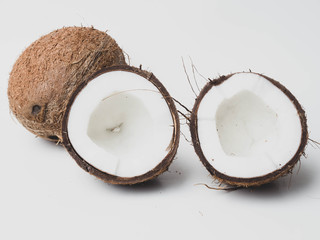 Ripe coconuts on white background