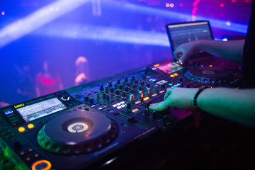 dj plays in night club