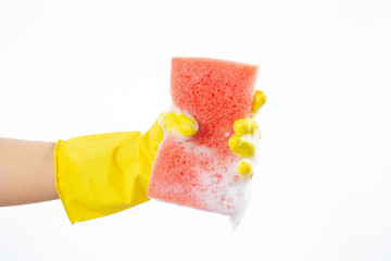 Hand squeezes out a sponge on a white background