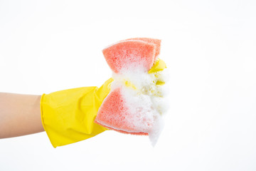Hand squeezes out a sponge on a white background