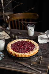 Cherry pie on wooden rustic table