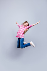 Full length vertical side profile body size photo blond haired she her little cheerleader jump...