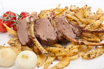 roasted spicy  rack of prime ribs and potatoes 