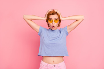 Portrait of her she nice cute charming attractive lovely winsome cheerful cheery stunned funny teen girl wearing casual blue t-shirt yellow glasses isolated over pink pastel background