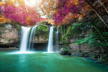 Fototapeta na wymiar Amazing in nature, beautiful waterfall at colorful autumn forest in fall season 