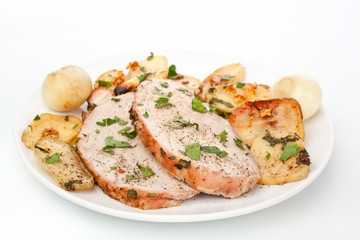 Sliced Boneless Pork Loin Roast on a plate with potato