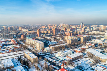 Fototapeta premium Aerial view of the modern city district. Winter, sunny day