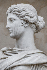 Ancient statue of sensual Italian renaissance era woman with long neck and curly hairs, Potsdam,...