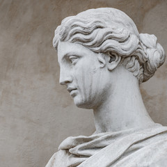 Ancient statue of sensual Italian renaissance era woman with long neck and curly hairs, Potsdam,...