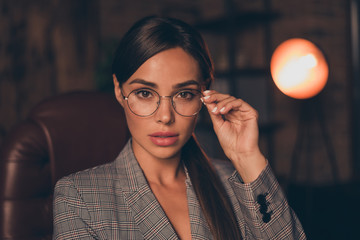 Close up photo beautiful stunning she her business lady chief work day night look attentively interview candidate interested sit big large office chair wear specs formal wear checkered plaid suit © deagreez