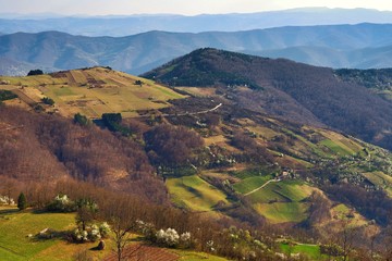 Stunning mountain scenery in spring in Europe with many green hills and trees