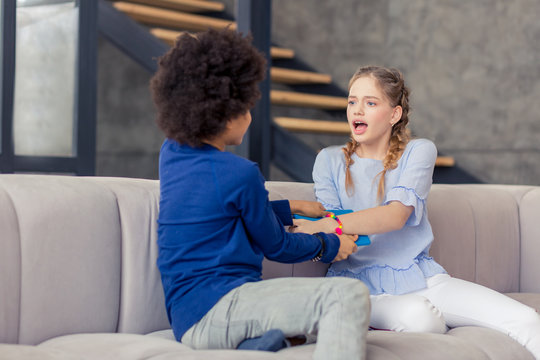 Irritated Longhaired Girl Shouting At Her Classmate