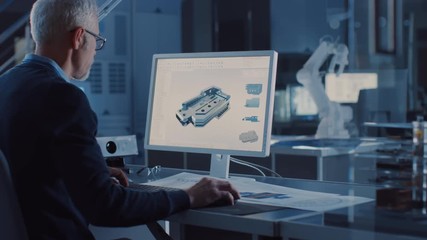 Professional Heavy Industry Engineer Works on Computer Uses CAD Software to Design 3D Industrial Machinery Component