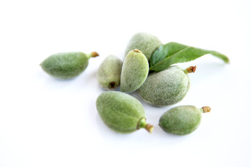 Fresh green almonds (cagla) isolated on white background