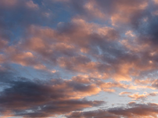 Naklejka na ściany i meble colorful blue sky with clouds at sunset.