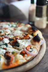 Tandoori Chicken Pizza on wooden table