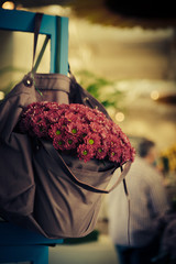 violet flowers in bag