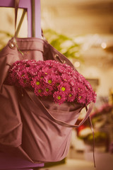 violet flowers in bag