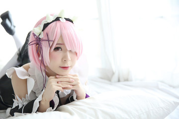 Portrait of Japan anime cosplay woman , white japanese maid in white tone room