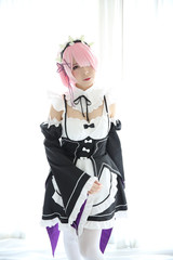 Portrait of Japan anime cosplay woman , white japanese maid in white tone room