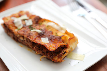 Beef lasagna on wooden background , Italian food