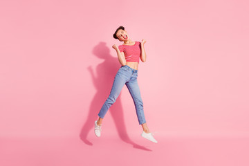 Fototapeta na wymiar Full length body size photo yelling beautiful she her lady pomade lips jump high sale discount shopping store mall wear casual jeans denim striped red white t-shirt sit floor isolated pink background