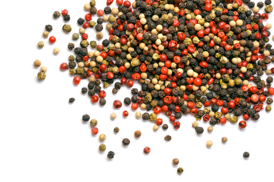 Black, red and white pepper grains isolated on white. Spice. Food.	
