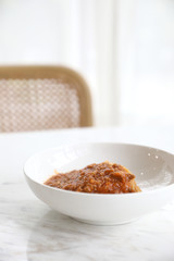 spaghetti Bolognese with minced beef and tomato sauce garnished with parmesan cheese and basil , Italian food