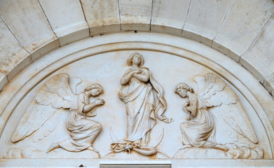 The Virgin Mary is surrounded by angels, portal of the parish church of St. Pelagius, was until 1828 Cathedral of the Diocese of Cittanova, Novigrad, Croatia
