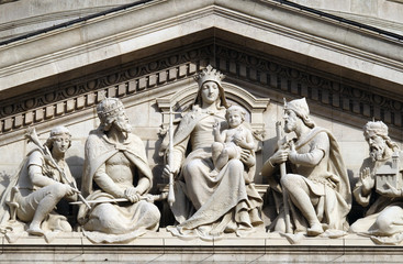 Tympanum bass relief showing the Virgin Mary and Hungarian saints, St. Stephen`s Basilica in Budapest, Hungary