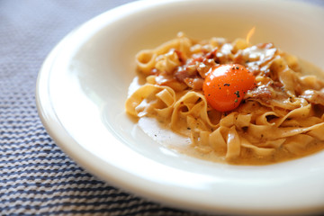 Homemade pasta with white sauce , spaghetti carbonara , italian food
