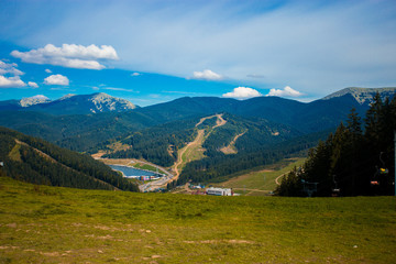 Fototapeta na wymiar Beautiful landscape of summer mountains with blue sky. Summer mountain village landscape