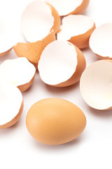 One egg lie down while other has cracked isolated on white background