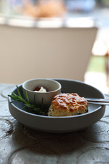 Scones with cream and strawberry jam