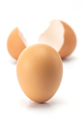 Strong egg stand up and broken egg portrait