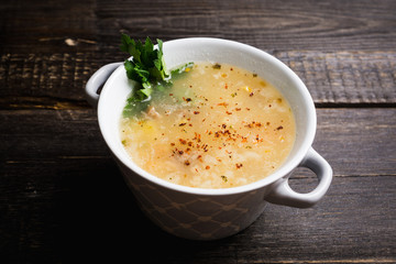 Fat meat soup with lamb based broth, chickpea and potatoes. Selective focus.
