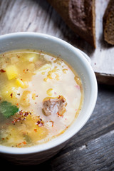 Fat meat soup with lamb based broth, chickpea and potatoes. Selective focus.