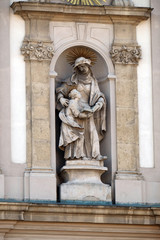 Fototapeta na wymiar Saint Ann with Virgin Mary statue on the facade of the Saint Anne church in Budapest, Hungary