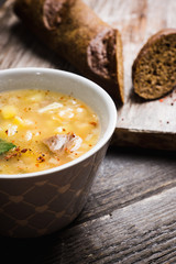 Fat meat soup with lamb based broth, chickpea and potatoes. Selective focus.