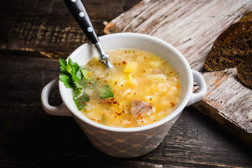 Fat meat soup with lamb based broth, chickpea and potatoes. Selective focus.