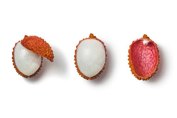 One ripe, half-peeled pink-red lychee on a white background with shadow. Side view