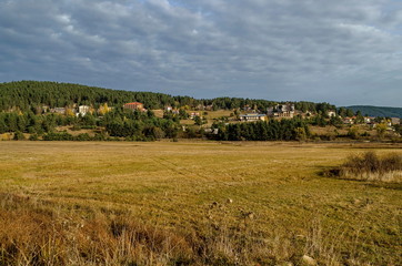 Obraz premium Batak dam with rest homes at the Rodopi mountain Bulgaria