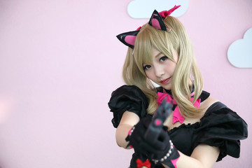Japan anime cosplay , portrait of girl cosplay in pink room background